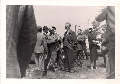 Photograph of people gathering