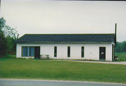 Outbuilding to a White Frame House on Highway #7