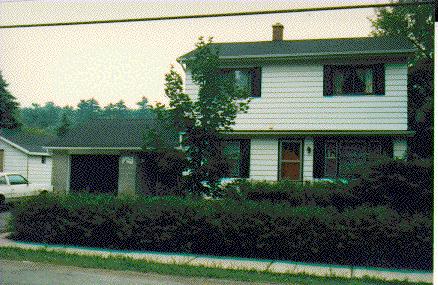 Two storey white sided home on Main Street 1990