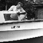 Perc Donaldson spruces up his boat, 1962