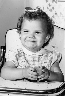 Young Girl in a high chair