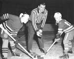 Faceoff by Maurice “Rocket” Richard between Doug Casburn and George Cook