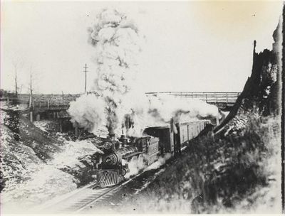 Steam Locomotive passes under the bridge at Limehouse