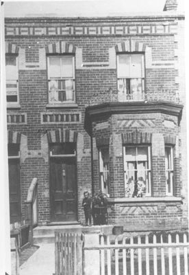 Boy in front of Syndicate House