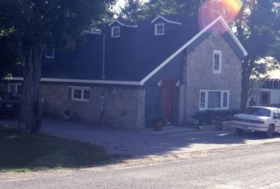 Stone House Behind Store