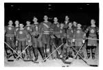 Little NHL hockey team “Toronto Maple Leafs” pose with their  trophy and their coach at Memorial Arena, 42 Mill Street.