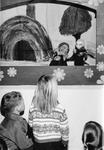 Georgetown Public Library - children watch a puppet show.