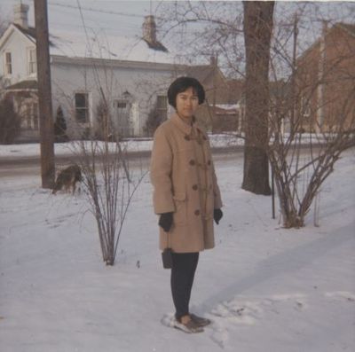 Nurse from the Philippines poses on Church Street - winter.