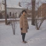 Nurse from the Philippines poses on Church Street - winter.