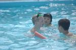 Seven-year-old Warren Gec meets up with his friends at the Acton Wading  Pool in Prospect Park.