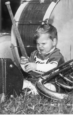 Dougie Ballentine Plays with a Baseball Bat Beside a  Bass Drum After Minor Baseball Day Parade.