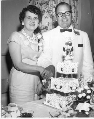 Dick and Anne Riddall Cut Their 25th Wedding Anniversary Cake