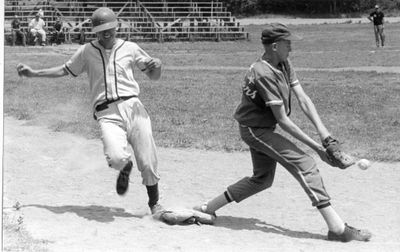 Steve Turner of the Georgetown Midgets Waits for the  Ball While Brampton Gets the Base.