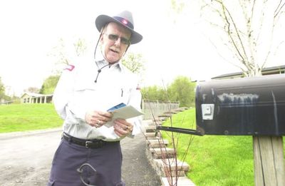 Norman McGowan delivers mail in the village.