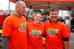 Mike Holmes and two volunteers at M&M Meat Shops Cohn's and Colitis Foundation fundraiser.