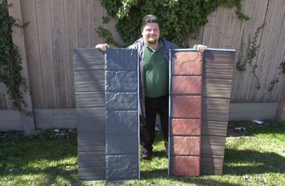 Vantage Roofing owner Jim Pushie shows off a few samples of metal roofing.