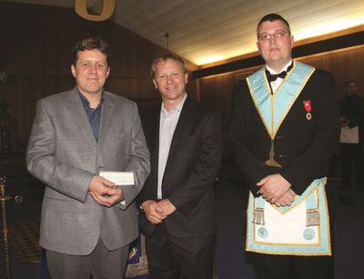 Senior Warden Brother Tom Allen presents cheque to Georgetown Hospital Foundation representitives.