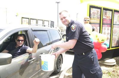 Halton Hills Fire fighters collect donations at McHappy Day.