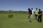 Jay Reinders participates in putting contest at the Paul Murr Memorial Golf Tournament at Blue Springs.