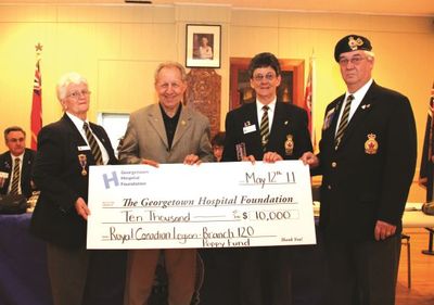 Laurent Thibeau accepts donation on behalf of Georgetown Hospital from the Royal Canadian Legion.