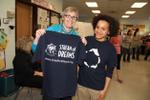 Carolyn Neilson receives Stream of Dreams t-shirt from Allison Qua-Enoo of the Credit Valley Conservation Authority.