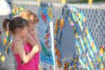 Alyssa and Madison Viozzi look for their painted fish at the McKenzie-Smith Bennett family education night