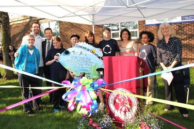 Local dignitaries unveil the Stream of Dreams project at the McKenzie-Smith Bennett family education night