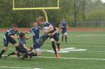Rebel Cory Carpenter brought down by Nick Tibbits and Andrew Punsack during Halton junior Rugby semifinal