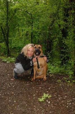 Kristin Porter poses with dog Guiness after being nipped at Hungry Hollow