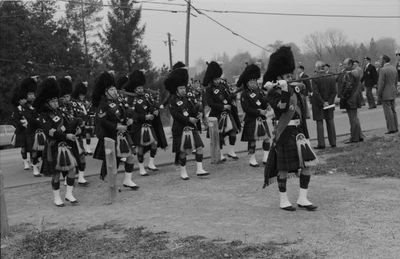 The Pipe Band marches onto the cenotaph grounds.