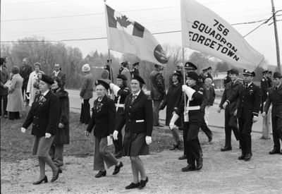 The Legion Ladies Auxiliary and the Air Cadet Squad 756 march onto cenotaph grounds