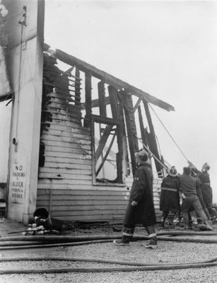 Georgetown Fire Department at burnt remains of garage in Norval