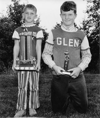 Kevin Frank (L) and Jim Carmichael accept MVP and Most improved player trophies, respectively, for the Glen softball Atoms.