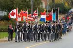 The Legion Colour Party leads the Remembrance Day parade.