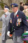 Wreath bearer Shel Lawr marches beside Marion Carney in Remembrance Day Parade