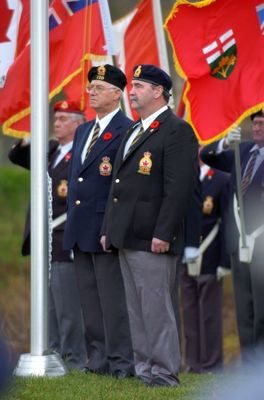 Georgetown Legion members in front of Flag Poles