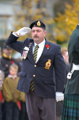 A Royal Canadian Legion member salutes during the Remembrance service.