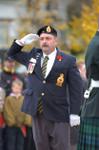 A Royal Canadian Legion member salutes during the Remembrance service.