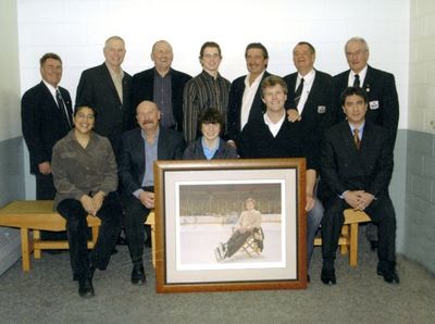 Locals pose with famous Bobby Ore print &quot;Garden of Dreams&quot;