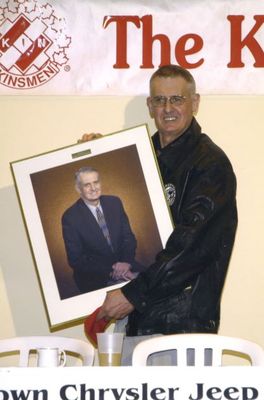 Charlie Hanman holding a photo of himself