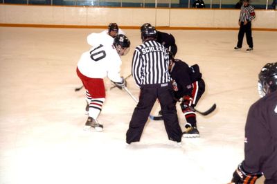 Linesman Scott Schlegel drops puck in Future Stars game