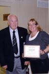 Sheila Campbell receiving an award from Georgetown Hockey Heritage Council