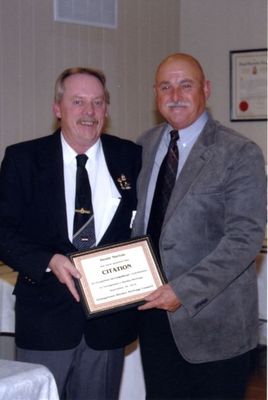 Dennis Norton being awarded a citation from the Georgetown Hockey Heritage Council