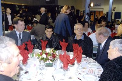 A table full of people at a Georgetown Hockey Heritage Council event