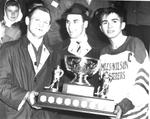 Bryon Goudy(R) and his coach Bob Delpellaro are presented with trophy by Dean Prentice