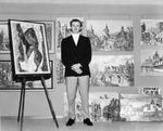 Gordon F. Price surrounded by some of the pictures in his Gallery