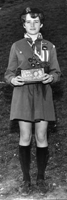 Sandra Freeman holding a box of Girl Guide Cookies