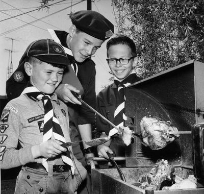 Cubs and Scouts practicing their BBQing skills