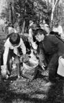 John Goudy and Mary Stief help clean up the grounds around Park School