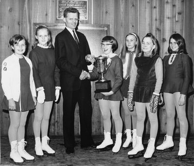 Young figure skaters receive their awards from Tom Pettingill